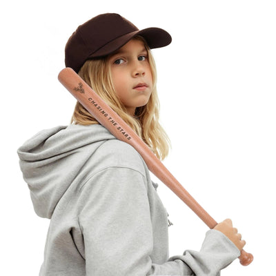 Personalized Mini Wooden Baseball Bat - Child in baseball cap holding bat | Our Phoenix Rise