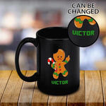 Personalized Angry Gingerbread Man Christmas Mug - Angled front view on wooden table with custom name zoom | Our Phoenix Rise