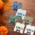 Husky Got Me Howlin' T-Shirt - Ivory Variant Folded | Our Phoenix Rise