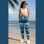 Dolphin Print Athletic Joggers - Woman Standing on Beach | Our Phoenix Rise