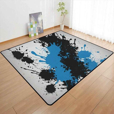Blue Black Paint Splatter Area Rug - full view in modern room | Our Phoenix Rise