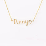 Personalized Script Name Necklace - Izzi name in gold on wooden stand | Our Phoenix Rise
