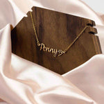 Personalized Pet Name Necklace with Paw Heart - Gold Penny on wooden display stand | Our Phoenix Rise