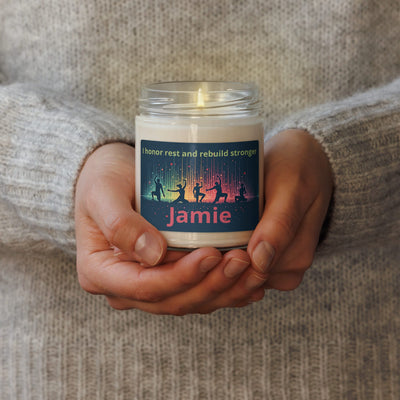 Personalized Yoga Scented Soy Candle - lit, held in hands, custom name 'Jamie', yoga silhouettes | Our Phoenix Rise