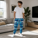 Dolphin Print Athletic Joggers - Lifestyle Beach Scene Mockup | Our Phoenix Rise