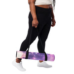 Yoga mat with purple galaxy print held by person in black leggings side angle | Our Phoenix Rise